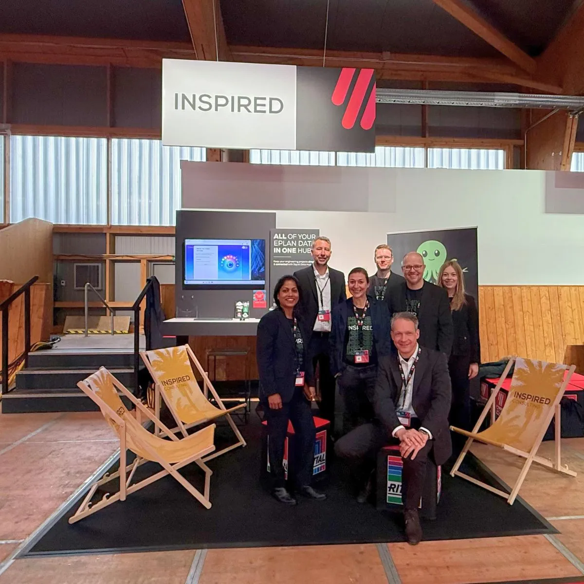 The Inspired Consulting team at their booth at Eplan Next26, with Squid Data Hub shown on screen